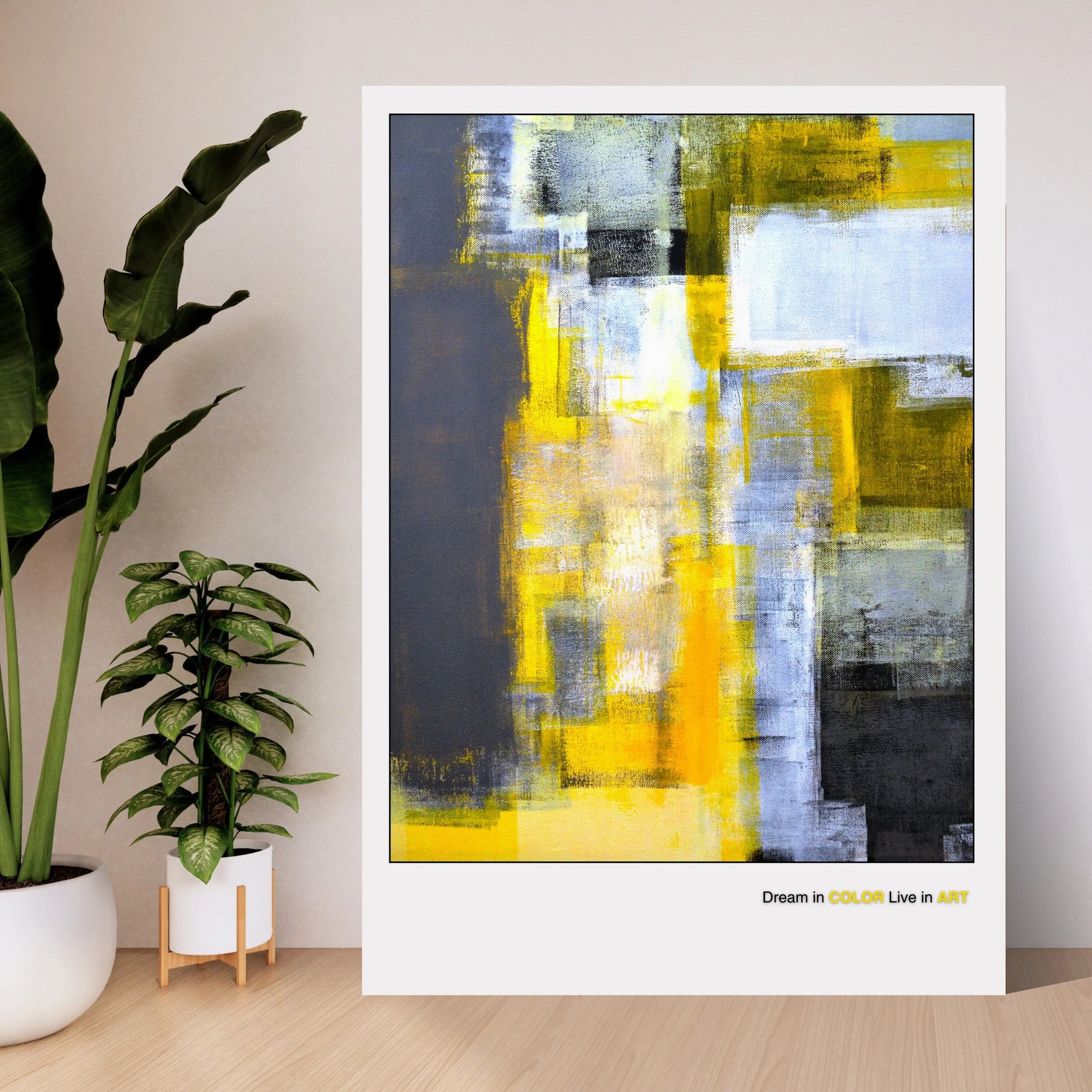 An abstract fine art poster featuring geometric shapes in yellow, gray, and black colors with the phrase 'Dream in COLOR Live in ART' at the bottom.