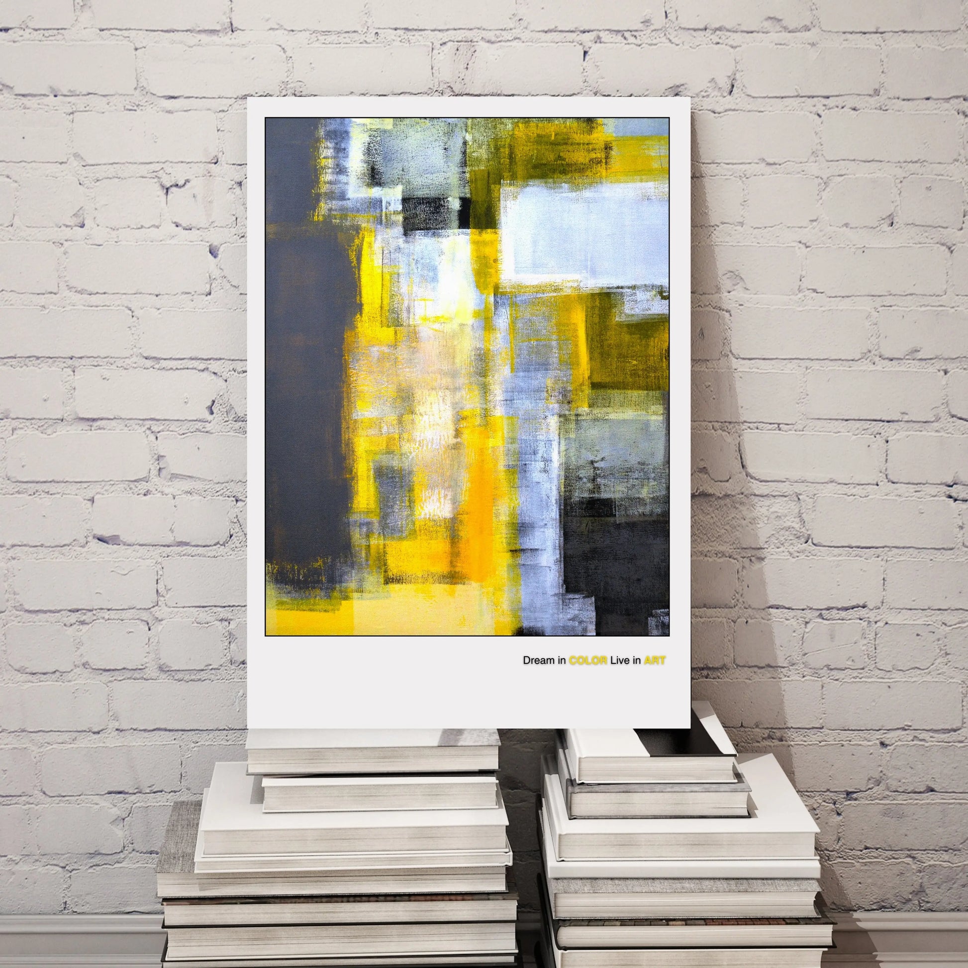An abstract fine art poster featuring geometric shapes in yellow, gray, and black colors with the phrase 'Dream in COLOR Live in ART' at the bottom.