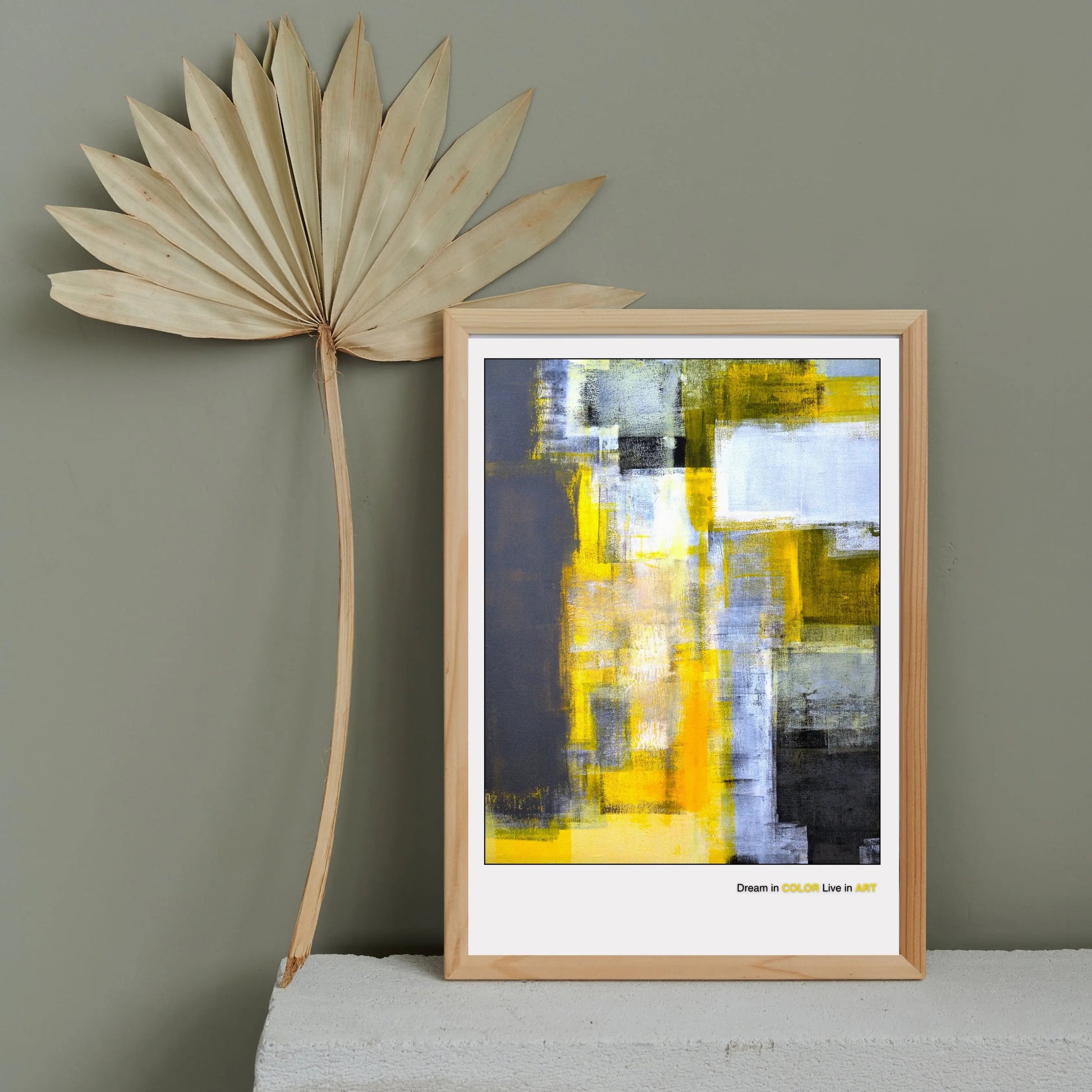 An abstract fine art poster featuring geometric shapes in yellow, gray, and black colors with the phrase 'Dream in COLOR Live in ART' at the bottom.